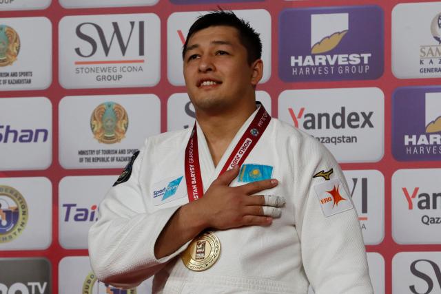 Gold medallist Kazakhstan's Marat Baikamurov celebrates on the podium for the men's under 100 kg event at the Astana Grand Slam judo tournament in Astana on May 10, 2026. (Photo by STANISLAV FILIPPOV / AFP)