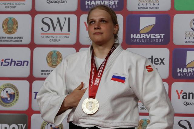 Gold medallist Russia's Elis Startseva celebrates on the podium for the women's over 78 kg event at the Astana Grand Slam judo tournament in Astana on May 10, 2026. (Photo by STANISLAV FILIPPOV / AFP)