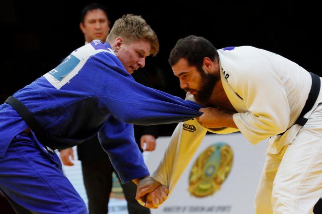 Germany's Erik Abramov (white) and Poland's Jakub Sordyl compete in the men's over 100 kg bronze medal bout at the Astana Grand Slam judo tournament in Astana on May 10, 2026. (Photo by STANISLAV FILIPPOV / AFP)