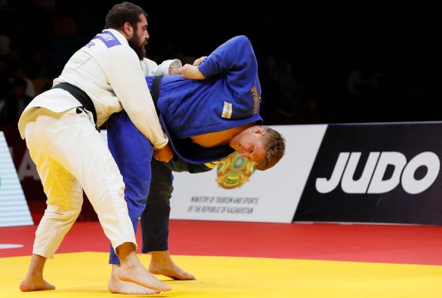 Germany's Erik Abramov (white) and Poland's Jakub Sordyl compete in the men's over 100 kg bronze medal bout at the Astana Grand Slam judo tournament in Astana on May 10, 2026. (Photo by STANISLAV FILIPPOV / AFP)