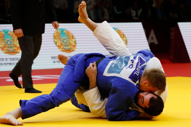 Germany's Erik Abramov (white) and Poland's Jakub Sordyl compete in the men's over 100 kg bronze medal bout at the Astana Grand Slam judo tournament in Astana on May 10, 2026. (Photo by STANISLAV FILIPPOV / AFP)