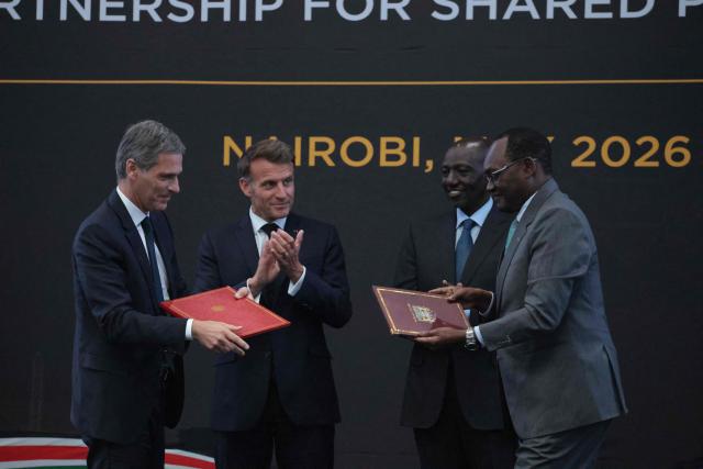 Chairman and Chief Executive Officer (CEO) of the CMA CGM Group Rodolphe Saade (1st L) signs an agreement with Kenya's Principal Secretary for National Treasury Chris Kiptoo (1st R) as  France's President Emmanuel Macron (2nd L) and Kenya's President William Ruto (2nd R) clap during a reception at State House ahead of the Africa Forward: Africa- France Partnerships for Innovation and Growth Summit in Nairobi, on May 10, 2026. Kenya and France will jointly host the “Africa Forward: Africa- France Partnerships for Innovation and Growth” Summit, which will bring together African and French Heads of State and Government. (Photo by Ludovic MARIN / AFP)