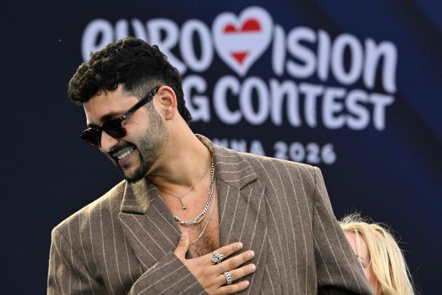 Israeli singer Noam Bettan, representing Israel with the song 'Michelle', poses for photographers on the turquoise carpet for the opening ceremony of the Eurovision Song Contest 2026 at the City Hall Square in Vienna, Austria on May 10, 2026. The event is the official starting point of Eurovision week in Vienna. The city will host the two semi-finals on May 12 and May 14 and the final on May 16, 2026. (Photo by Tobias SCHWARZ / AFP)