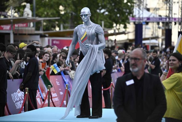Lithuanian singer Lion Ceccah, representing Lithuania with the song 'Solo Quiero Mas', pose for photographers on the turquoise carpet for the opening ceremony of the Eurovision Song Contest 2026 at the City Hall Square in Vienna, Austria on May 10, 2026. The event is the official starting point of Eurovision week in Vienna. The city will host the two semi-finals on May 12 and May 14 and the final on May 16, 2026. (Photo by Tobias SCHWARZ / AFP)