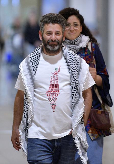 Spanish national of Palestinian origin Saif Abu Keshek, activist from a Gaza-bound aid flotilla, leaves Barcelona airport, on May 10, 2026  upon his arrival following his release by Israeli authorities. Israeli forces intercepted the flotilla in international waters off Greece last week, expelling the activists to Europe but arresting Abu Keshek and another activist from Gaza-bound aid flotilla. (Photo by MANAURE QUINTERO / AFP)