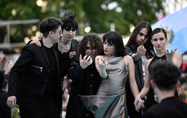 Romanian singer Alexandra Capitanescu, representing Romania with the song 'Choke Me', pose for photographers on the turquoise carpet for the opening ceremony of the Eurovision Song Contest 2026 at the City Hall Square in Vienna, Austria on May 10, 2026. The event is the official starting point of Eurovision week in Vienna. The city will host the two semi-finals on May 12 and May 14 and the final on May 16, 2026. (Photo by Tobias SCHWARZ / AFP)