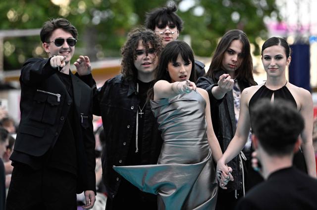 Romanian singer Alexandra Capitanescu, representing Romania with the song 'Choke Me', pose for photographers on the turquoise carpet for the opening ceremony of the Eurovision Song Contest 2026 at the City Hall Square in Vienna, Austria on May 10, 2026. The event is the official starting point of Eurovision week in Vienna. The city will host the two semi-finals on May 12 and May 14 and the final on May 16, 2026. (Photo by Tobias SCHWARZ / AFP)