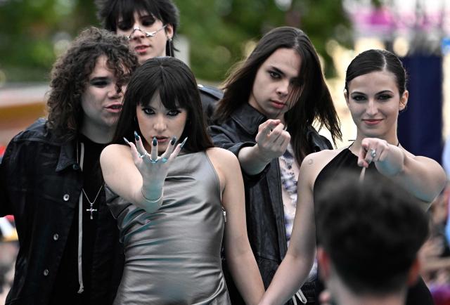 Romanian singer Alexandra Capitanescu, representing Romania with the song 'Choke Me', pose for photographers on the turquoise carpet for the opening ceremony of the Eurovision Song Contest 2026 at the City Hall Square in Vienna, Austria on May 10, 2026. The event is the official starting point of Eurovision week in Vienna. The city will host the two semi-finals on May 12 and May 14 and the final on May 16, 2026. (Photo by Tobias SCHWARZ / AFP)