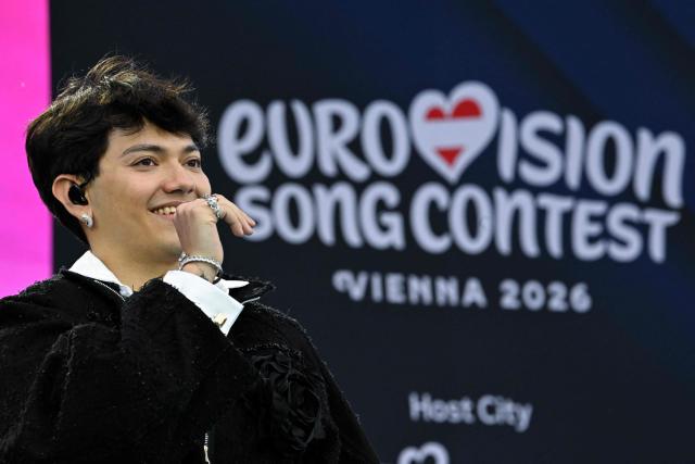 Austrian singer Johannes Pietsch aka JJ, winner of the 2025 Eurovision Song Contest (ESC) speaks at the opening ceremony of the Eurovision Song Contest 2026 at the City Hall Square in Vienna, Austria on May 10, 2026. The event is the official starting point of Eurovision week in Vienna. The city will host the two semi-finals on May 12 and May 14 and the final on May 16, 2026. (Photo by Tobias SCHWARZ / AFP)