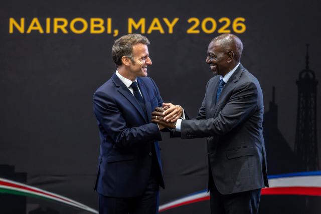 TOPSHOT - France's President Emmanuel Macron (L) shakes hands with Kenya's President William Ruto (R) during the signing of bilateral agreements at State House ahead of the Africa Forward: Africa- France Partnerships for Innovation and Growth Summit in Nairobi, on May 10, 2026. Kenya and France will jointly host the “Africa Forward: Africa- France Partnerships for Innovation and Growth” Summit, which will bring together African and French Heads of State and Government. (Photo by Luis TATO / AFP)