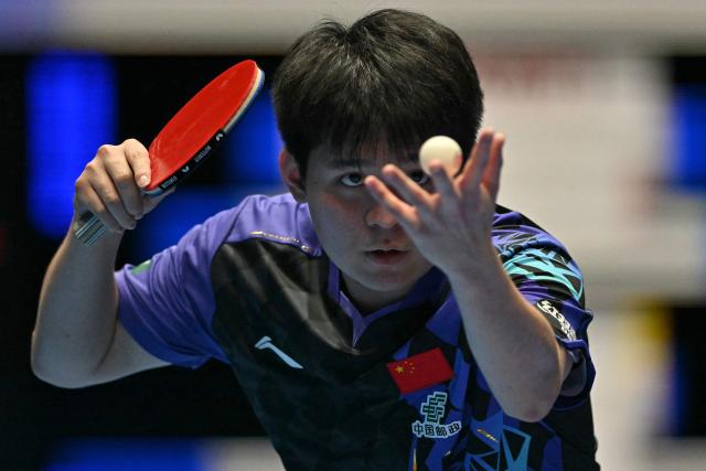 China's Lin Shidong serves against Japan's Shunsuke Togami during their Men's Teams final match at the ITTF World Table Tennis Championships in Wembley Arena, west London on May 10, 2026. (Photo by Glyn KIRK / AFP)