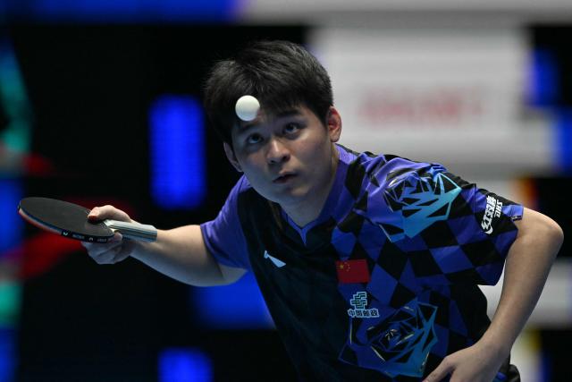 China's Lin Shidong serves against Japan's Shunsuke Togami during their Men's Teams final match at the ITTF World Table Tennis Championships in Wembley Arena, west London on May 10, 2026. (Photo by Glyn KIRK / AFP)