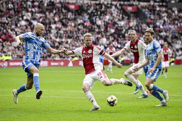 Ajax's Dutch midfielder #18 Davy Klaassen (C) prepares to shoot despite Utrecht's Dutch defender #03 Mike van der Hoorn (L) during the Dutch Eredivisie football match between Ajax Amsterdam and FC Utrecht at the Johan Cruijff ArenA in Amsterdam on May 10, 2026. (Photo by Olaf Kraak / ANP / AFP) / Netherlands OUT