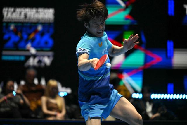 Japan's Shunsuke Togami returns against China's Lin Shidong during their Men's Teams final match at the ITTF World Table Tennis Championships in Wembley Arena, west London on May 10, 2026. (Photo by Glyn KIRK / AFP)