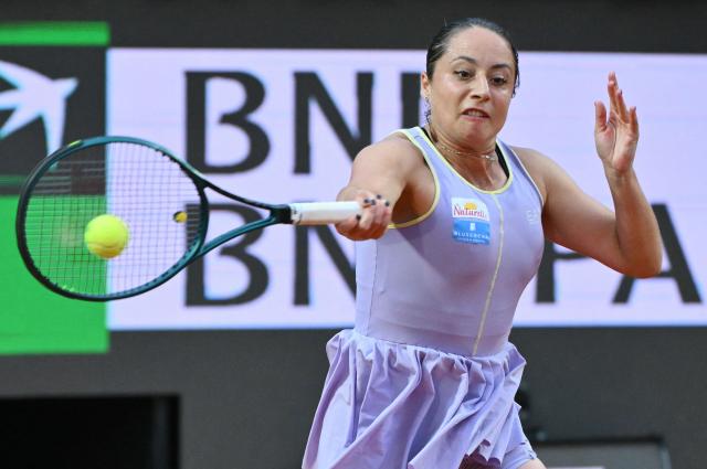 Italy's Elisabetta Cocciaretto plays a forehand return to Poland's Iga Swiatek during their women's singles match at the WTA Rome Open tennis tournament at Foro Italico in Rome on May 10, 2026. (Photo by Alberto PIZZOLI / AFP)