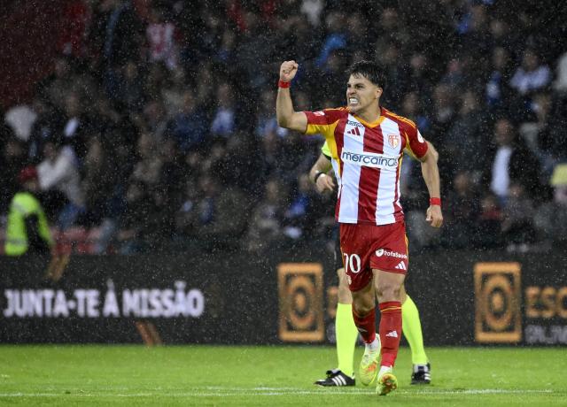 AVS' Brazilian midfielder #70 Roni celebrates scoring his team's second goal during the Portuguese League football match between AVS Futebol SAD and FC Porto at at CD Aves stadium in Vila das Aves on May 10, 2026. (Photo by Miguel RIOPA / AFP)
