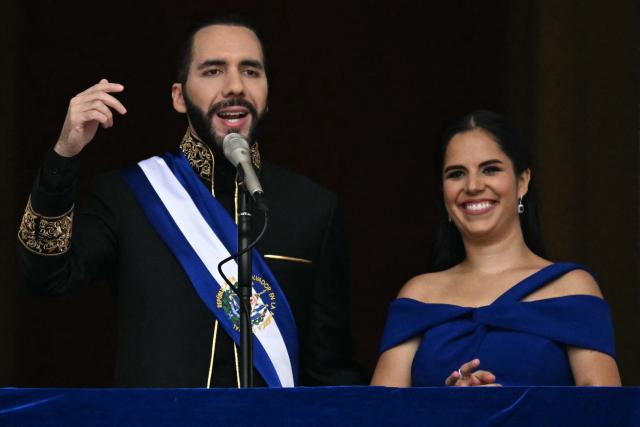 (FILES) El Salvador's President Nayib Bukele (L) addresses the attendees next to his wife Gabriela Rodriguez after being sworn in at the National Palace in downtown San Salvador on June 1, 2024. Amnesty International on May 10 urged El Salvador's first lady Gabriela Rodriguez to facilitate dialogue between authorities and the mothers of thousands of detainees held under the state of emergency, so they can learn the whereabouts of their relatives and exercise their rights. (Photo by Marvin RECINOS / AFP)