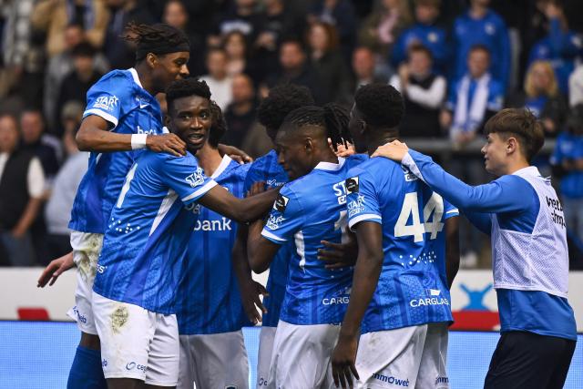 Genk's Cameroonian forward Aaron Bibout (L) celebrates after scoring during the Belgian Pro League football match between KRC Genk and KVC Westerlo at the Cegeka arena in Genk on May 10, 2026. (Photo by Johan Eyckens / Belga / AFP) / Belgium OUT