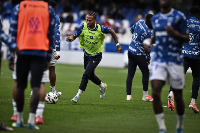 Auxerre players warm up prior to the French L1 football match between AJ Auxerre and OGC Nice at the Stade de l'Abbe-Deschamps in Auxerre, central France, on May 10, 2026. (Photo by JEFF PACHOUD / AFP)