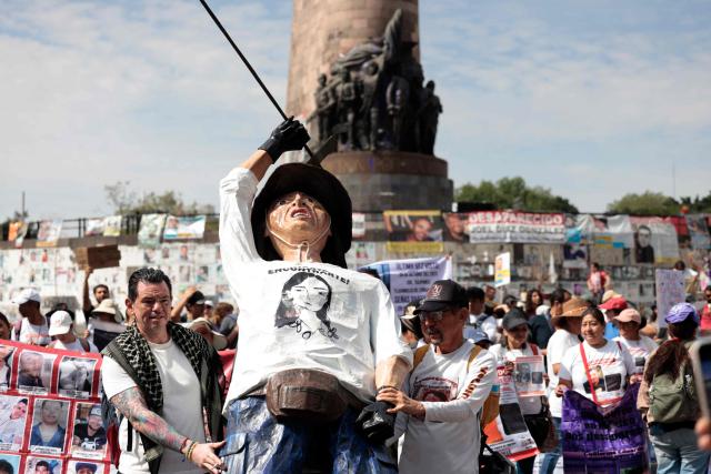 Men carry a cardboard cutout depicting a mother searching for her missing child during a protest on Mother's Day, in Guadalajara, Jalisco state, Mexico, on May 10, 2026. (Photo by ULISES RUIZ / AFP)