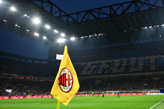AC Milan' fans spell with lights the slogan "G.F. Out", refering to AC Milan's President Giorgio Furlani, during the Italian Serie A football match between AC Milan and Atalanta Bergamo at San Siro Stadium in Milan on May 10, 2026. (Photo by Piero CRUCIATTI / AFP)