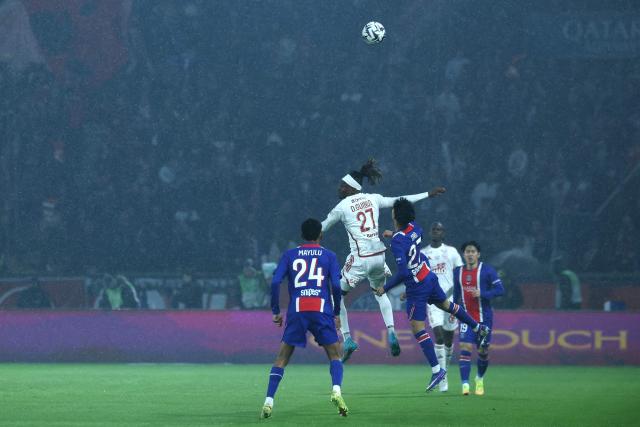 Brest's Malian defender #27 Daouda Guindo fights for the ball with Paris Saint-Germain's Spanish midfielder #27 Dro Fernandez (R) during the French L1 football match between Paris Saint-Germain (PSG) and Stade Brestois 29 (Brest) at the Parc des Princes stadium in Paris on May 10, 2026. (Photo by Xavier GALIANA / AFP)