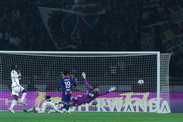 Brest's French goalkeeper #30 Gregoire Coudert deflects the ball during the French L1 football match between Paris Saint-Germain (PSG) and Stade Brestois 29 (Brest) at the Parc des Princes stadium in Paris on May 10, 2026. (Photo by Xavier GALIANA / AFP)