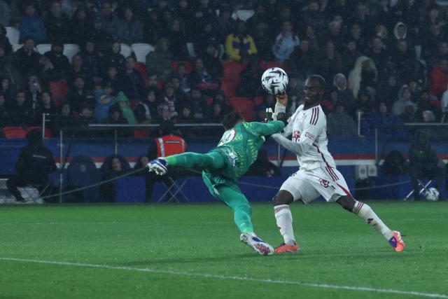 Paris Saint-Germain's Italian goalkeeper #89 Renato Marin makes a save on front of Brest's Malian midfielder #23 Kamory Doumbia during the French L1 football match between Paris Saint-Germain (PSG) and Stade Brestois 29 (Brest) at the Parc des Princes stadium in Paris on May 10, 2026. (Photo by Xavier GALIANA / AFP)