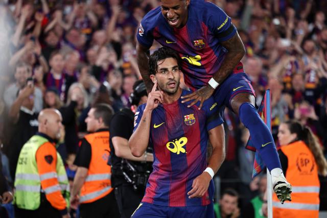 Barcelona's Spanish forward #07 Ferran Torres celebrates scoring his team's second goal with Barcelona's English forward #14 Marcus Rashford during the Spanish league football match between FC Barcelona and Real Madrid CF at Camp Nou Stadium in Barcelona on May 10, 2026. (Photo by Josep LAGO / AFP)