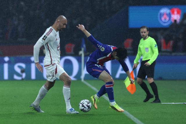 Paris Saint-Germain's South Korean midfielder #19 Lee Kang-in (R) fights for the ball with Brest's French forward #19 Ludovic Ajorque during the French L1 football match between Paris Saint-Germain (PSG) and Stade Brestois 29 (Brest) at the Parc des Princes stadium in Paris on May 10, 2026. (Photo by Xavier GALIANA / AFP)