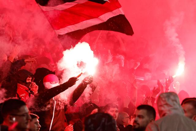 A Rennes Ultras supporter lights smoke bombs in a stand during the French L1 football match between Stade Rennais FC and Paris FC at the Roazhon Park stadium in Rennes, western France on May 10, 2026. (Photo by SIMON WOHLFAHRT / AFP)