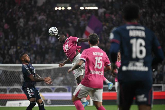 Toulouse's French midfielder #45 Alexis Vossah (C/L) heads the ball during the French L1 football match between Toulouse FC and Olympique Lyonnais (OL) at the TFC Stadium in Toulouse, south-western France on May 10, 2026. (Photo by Ed JONES / AFP)