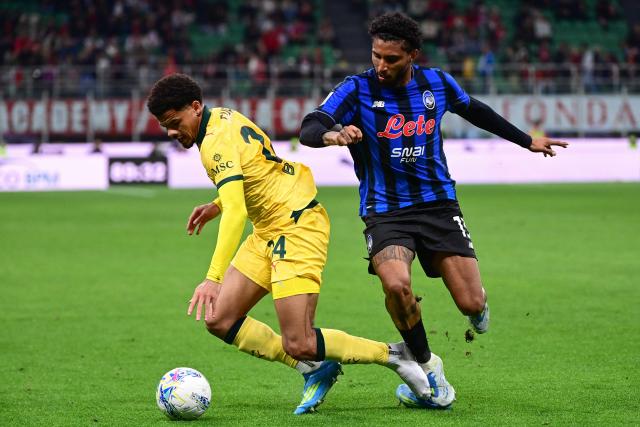 AC Milan's Swiss defender #24 Zachary Athekame (L) fights for the ball with Atalanta's Brazilian midfielder #13 Ederson during the Italian Serie A football match between AC Milan and Atalanta Bergamo at San Siro Stadium in Milan on May 10, 2026. (Photo by Piero CRUCIATTI / AFP)