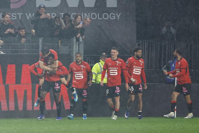 Rennes' Swiss forward #07 Breel Embolo (L) celebrates with teammates after scoring his team's second goal during the French L1 football match between Stade Rennais FC and Paris FC at the Roazhon Park stadium in Rennes, western France on May 10, 2026. (Photo by SIMON WOHLFAHRT / AFP)