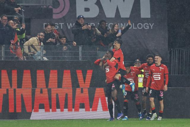 Rennes' Swiss forward #07 Breel Embolo (C) celebrates with teammates after scoring his team's second goal during the French L1 football match between Stade Rennais FC and Paris FC at the Roazhon Park stadium in Rennes, western France on May 10, 2026. (Photo by SIMON WOHLFAHRT / AFP)