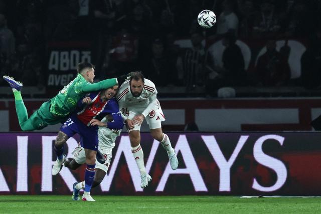 TOPSHOT - Paris Saint-Germain's Italian goalkeeper #89 Renato Marin punches out the ball next to Paris Saint-Germain's Spanish midfielder #27 Dro Fernandez (C) and Brest's French midfielder #24 Lucas Tousart (R) during the French L1 football match between Paris Saint-Germain (PSG) and Stade Brestois 29 (Brest) at the Parc des Princes stadium in Paris on May 10, 2026. (Photo by Xavier GALIANA / AFP)