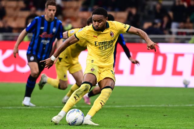 AC Milan's French forward #18 Christopher Nkunku scores a penalty kick during the Italian Serie A football match between AC Milan and Atalanta Bergamo at San Siro Stadium in Milan on May 10, 2026. (Photo by Piero CRUCIATTI / AFP)