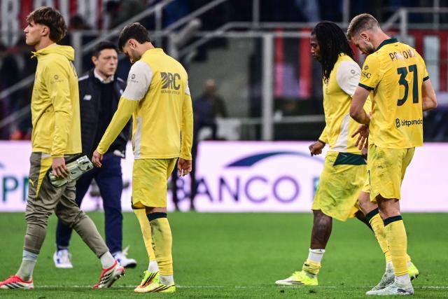 AC Milan's Portuguese forward #10 Rafael Leao (2nd R) and AC Milan's Serbian defender #31 Strahinja Pavlovic (R) react at the end of the Italian Serie A football match between AC Milan and Atalanta Bergamo at San Siro Stadium in Milan on May 10, 2026. (Photo by Piero CRUCIATTI / AFP)