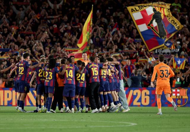 Barcelona's players celebrate winning the Spanish league football match between FC Barcelona and Real Madrid CF at Camp Nou Stadium in Barcelona on May 10, 2026. Barcelona won 2-0. (Photo by Lluis GENE / AFP)