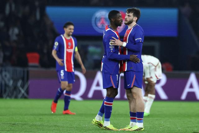 Paris Saint-Germain's French forward #10 Ousmane Dembele (L) and Paris Saint-Germain's Georgian forward #07 Khvicha Kvaratskhelia celebrate after winning the French L1 football match between Paris Saint-Germain (PSG) and Stade Brestois 29 (Brest) at the Parc des Princes stadium in Paris on May 10, 2026. (Photo by Xavier GALIANA / AFP)