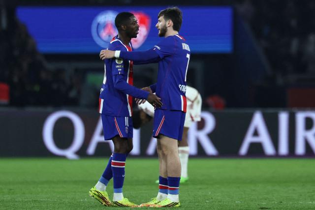 Paris Saint-Germain's French forward #10 Ousmane Dembele (L) and Paris Saint-Germain's Georgian forward #07 Khvicha Kvaratskhelia celebrate after winning the French L1 football match between Paris Saint-Germain (PSG) and Stade Brestois 29 (Brest) at the Parc des Princes stadium in Paris on May 10, 2026. (Photo by Xavier GALIANA / AFP)