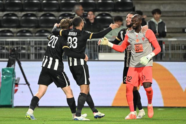 (From L) Angers' French defender #20 Marius Louer, Angers' Algerian midfielder #93 Haris Belkebla and Angers' Burkinabe goalkeeper #12 Herve Koffi (R) react at the end of the French L1 football match between SCO Angers and RC Strasbourg Alsace (RCSA) at the Stade Raymond-Kopa in Angers on Mayh 10, 2026. (Photo by Sebastien Salom-Gomis / AFP)