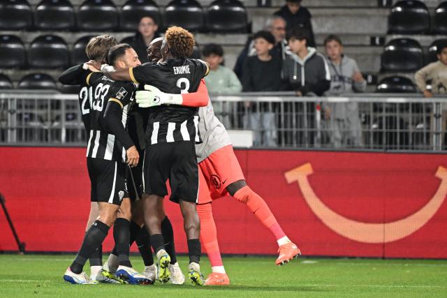 (From L) Angers' French defender #20 Marius Louer, Angers' Algerian midfielder #93 Haris Belkebla, Angers' Burkinabe goalkeeper #12 Herve Koffi and Angers' Gabonese defender #03 Jacques Ekomie react at the end of the French L1 football match between SCO Angers and RC Strasbourg Alsace (RCSA) at the Stade Raymond-Kopa in Angers on Mayh 10, 2026. (Photo by Sebastien Salom-Gomis / AFP)