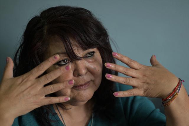 Isabel Diaz, a hantavirus survivor and daughter of Victor Diaz, who was identified by health authorities as patient zero in the 2018-2019 hantavirus outbreak that killed 11 people including her mother, gestures while speaking with AFP at her home in Epuyen, Chubut province, Argentina, on May 9, 2026. (Photo by JUAN MABROMATA / AFP)
