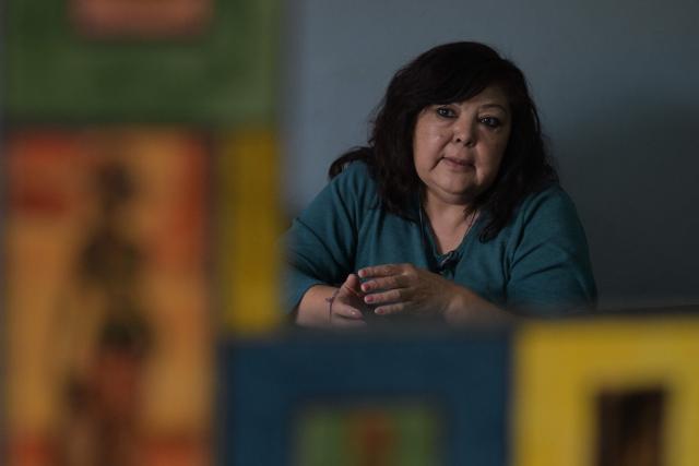 Isabel Diaz, a hantavirus survivor and daughter of Victor Diaz, who was identified by health authorities as patient zero in the 2018-2019 hantavirus outbreak that killed 11 people including her mother, gestures while speaking with AFP at her home in Epuyen, Chubut province, Argentina, on May 9, 2026. (Photo by JUAN MABROMATA / AFP)