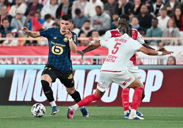 Lille's Belgian forward #7 Matias Fernandez-Pardo (L) runs with the ball during the French L1 football match between AS Monaco and LOSC Lille at the Stade Louis II in the Principality of Monaco on May 10, 2026. (Photo by Frederic DIDES / AFP)
