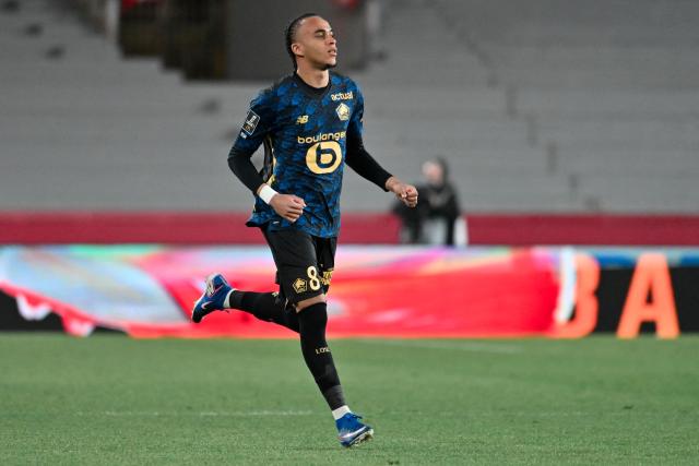Lille's forward #8 Ethan Mbappé runs with the ball during the French L1 football match between AS Monaco and LOSC Lille at the Stade Louis II in the Principality of Monaco on May 10, 2026. (Photo by Frederic DIDES / AFP)