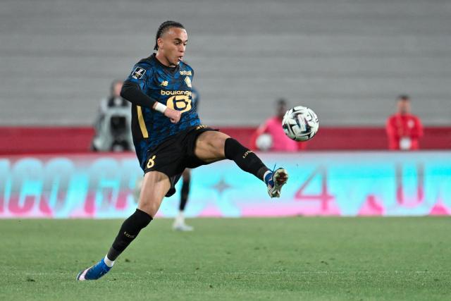 Lille's forward #8 Ethan Mbappé runs with the ball during the French L1 football match between AS Monaco and LOSC Lille at the Stade Louis II in the Principality of Monaco on May 10, 2026. (Photo by Frederic DIDES / AFP)