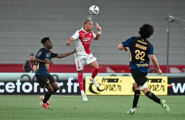 Monaco’s German defender #5 Thilo Kehrer heads the ball during the French L1 football match between AS Monaco and LOSC Lille at the Stade Louis II in the Principality of Monaco on May 10, 2026. (Photo by Frederic DIDES / AFP)
