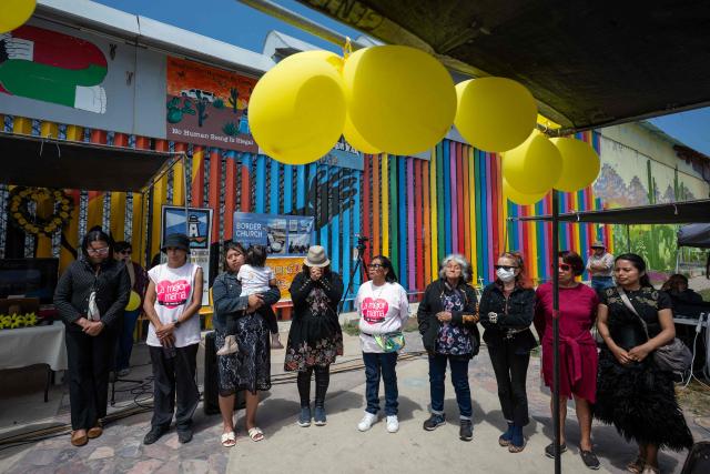Migrant mothers attend a mass service during Mother's Day at the Mexico-US border in Playas de Tijuana, Baja California state, Mexico on May 10, 2026. (Photo by Guillermo ARIAS / AFP)